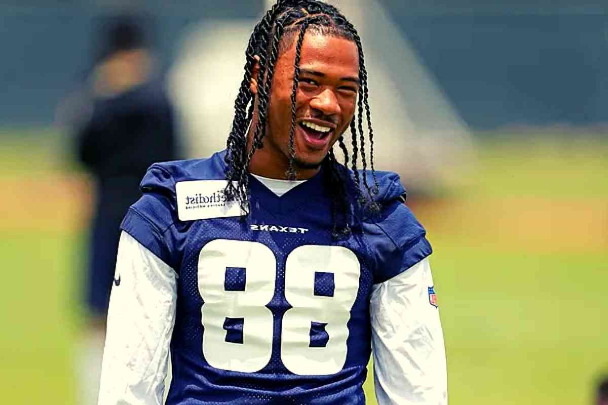 John Metchie III smiles during an NFL football rookie minicamp practice